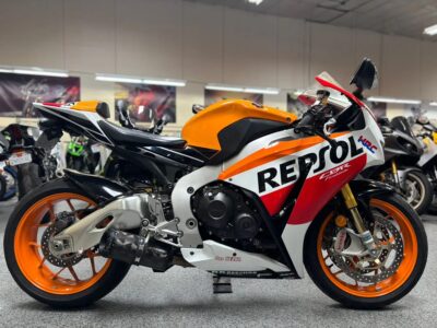 Pre‑owned sport motorcycle with showroom background at AK Motorcycles in El Cajon.