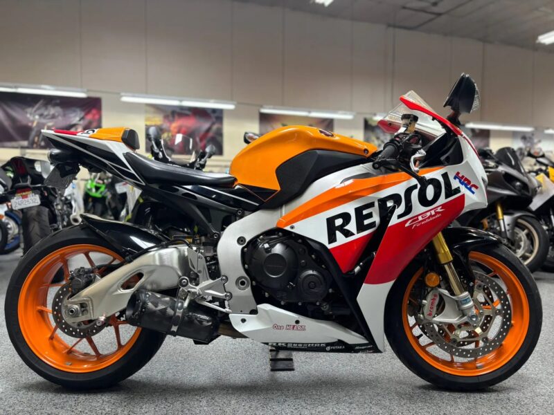 Pre‑owned sport motorcycle with showroom background at AK Motorcycles in El Cajon.