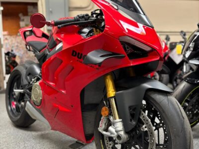 Sport motorcycle side view in a showroom with other bikes in the background