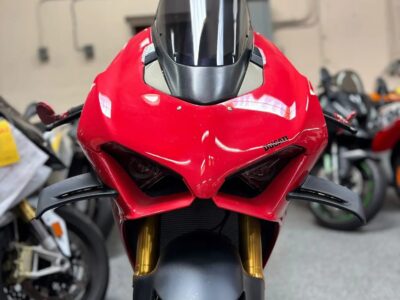 Pre-owned red performance motorcycle on display